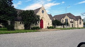 The stone frontage and red door of St. Paul's Episcopal Church